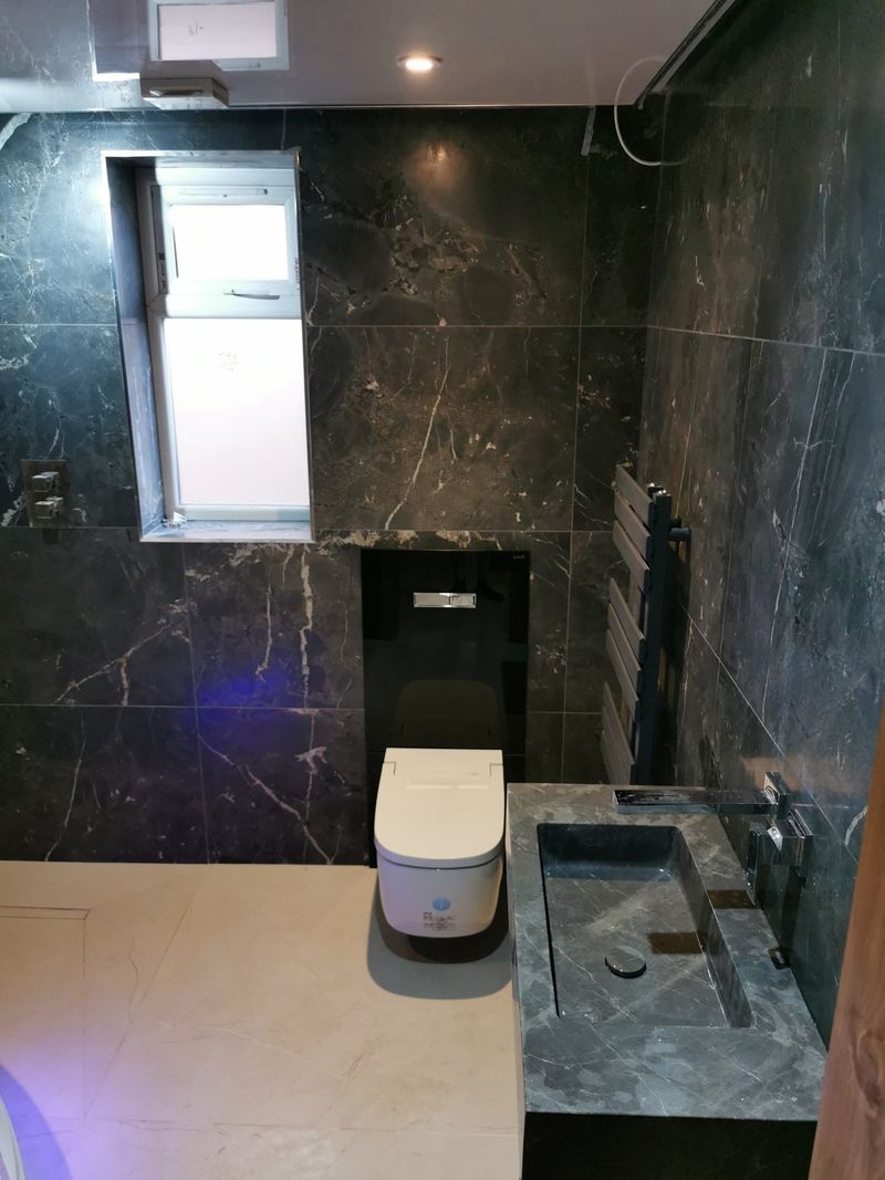 Black marble bathroom with corner spa bath - finished 1