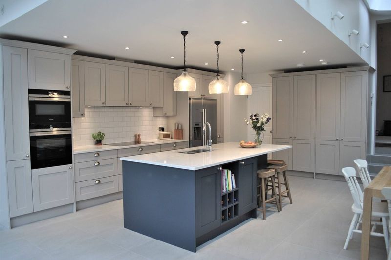Shaker kitchen with a central island and pendant lighting